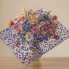 Premium clear acrylic block with embedded blue and purple flakes by Grandview Acrylic, ideal for custom decorative displays.