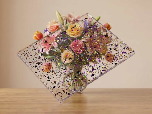Clear decorative acrylic panel with evenly distributed embedded flakes, manufactured by Grandview Acrylic.