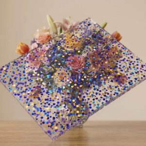 Premium clear acrylic block with embedded blue and purple flakes by Grandview Acrylic, ideal for custom decorative displays.