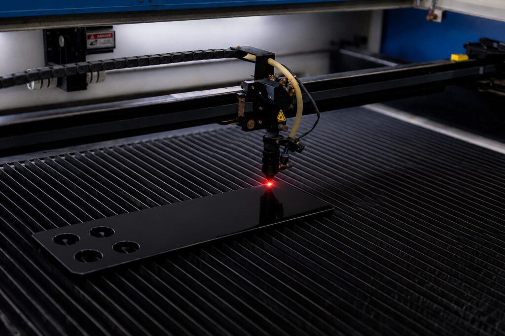 Laser cutting custom black acrylic sheets for signage and OEM components
