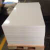 glossy-white-acrylic-sheets-stock Glossy white acrylic sheets stacked on a wooden pallet