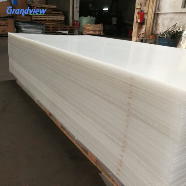 large-white-acrylic-sheets-warehouse Large white acrylic sheets stacked in a factory warehouse