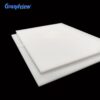 opaque-white-acrylic-sheets Opaque white acrylic sheets stacked against a black background