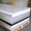 white-acrylic-sheet-product-range White, translucent and black acrylic sheets stacked on pallets